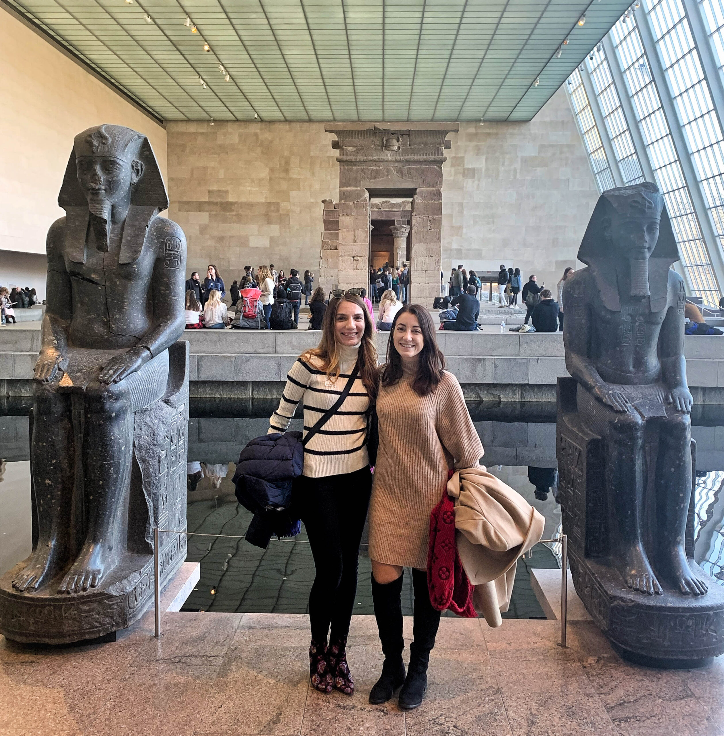 Two girls in front of Egyptian temple inside the Met museum