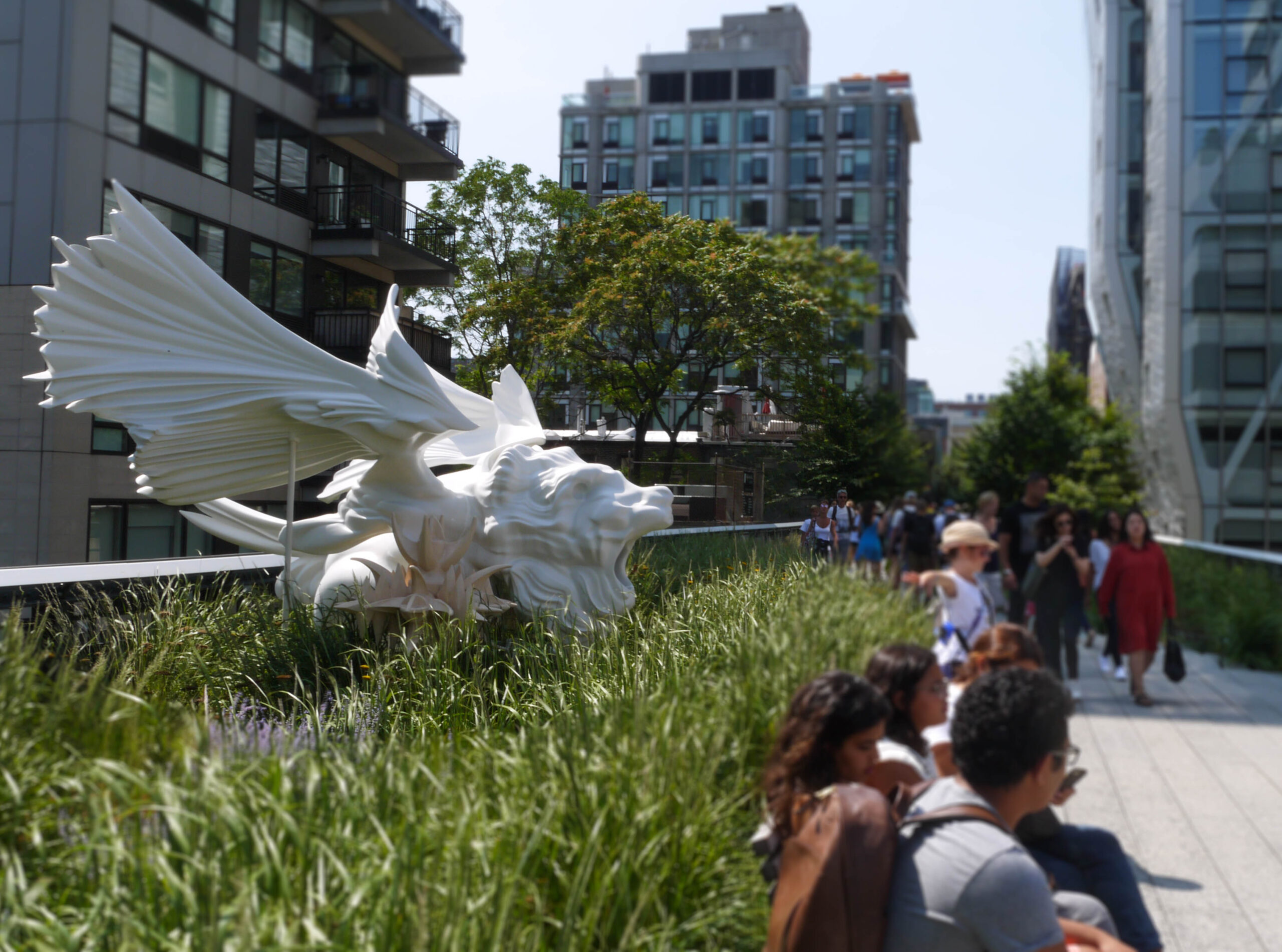 Best of New York - A park with quirky statues and people walking along the alley