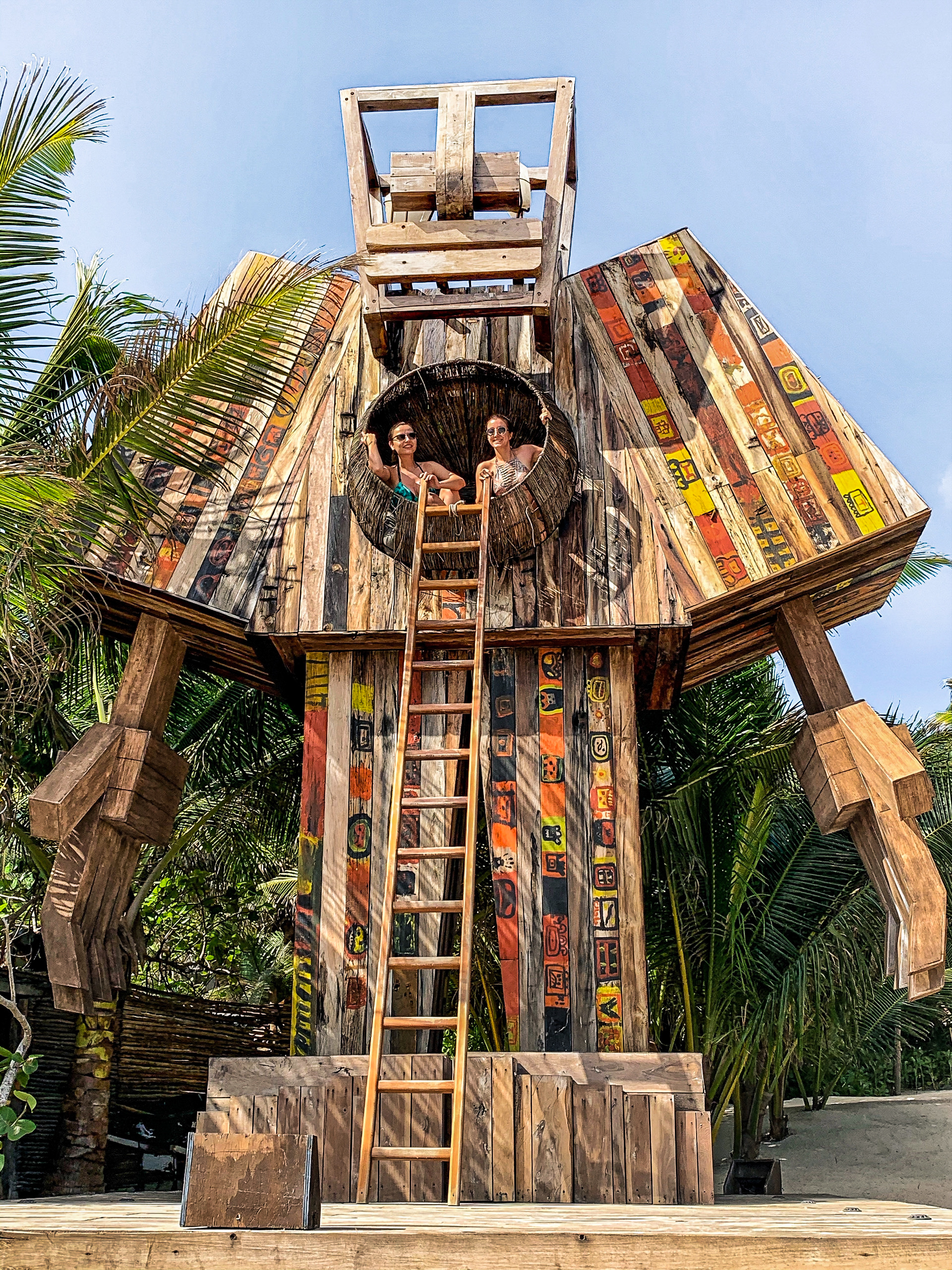 Wooden sculpture on the beach Nomade Tulum